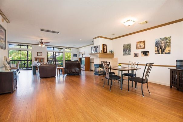 Dining room, Fireplace, Interior, Living room, Recessed Lighting, Wood Texture Flooring