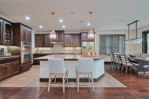 Dining room, Interior, Kitchen, Pendant Lights, Recessed Lighting, Stainless Steel Appliances, Wood Texture Flooring