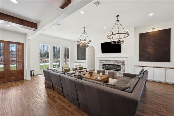 Chandelier, Fireplace, Interior, Living room, Pendant Lights, Recessed Lighting, Wooden Beams, Wood Texture Flooring