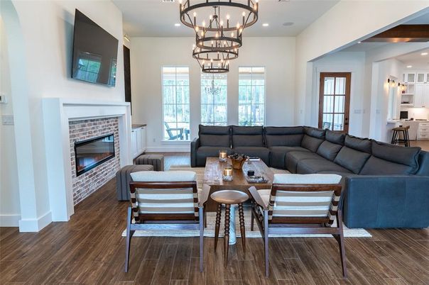 Chandelier, Dining room, Fireplace, Interior, Living room, Recessed Lighting, Wood Texture Flooring