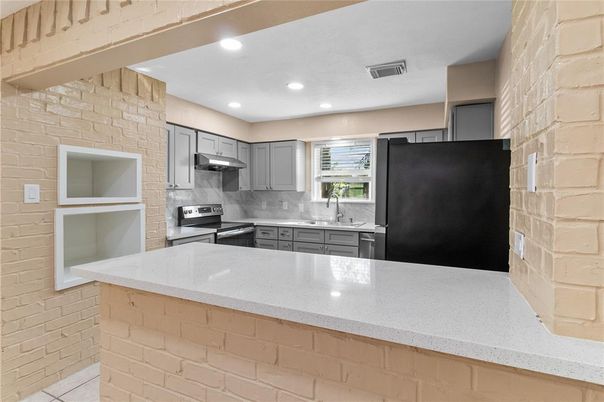 Interior, Kitchen, Recessed Lighting, Stainless Steel Appliances, Stone Walls