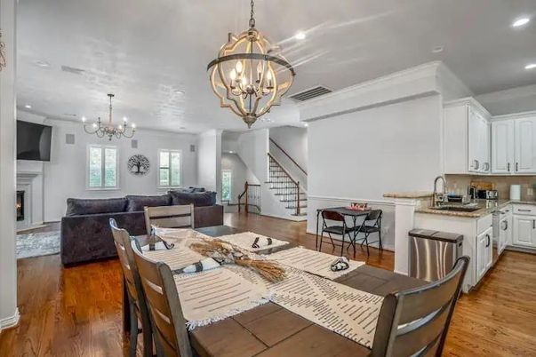 Chandelier, Dining room, Fireplace, Interior, Kitchen, Living room, Pendant Lights, Recessed Lighting, Stainless Steel Appliances, Wood Texture Flooring