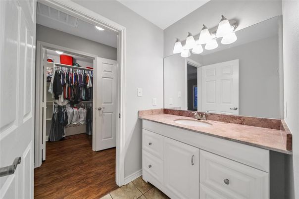 Bathroom, Dual Sink Vanities, Interior, Recessed Lighting, Walk-in Closets, Wood Texture Flooring