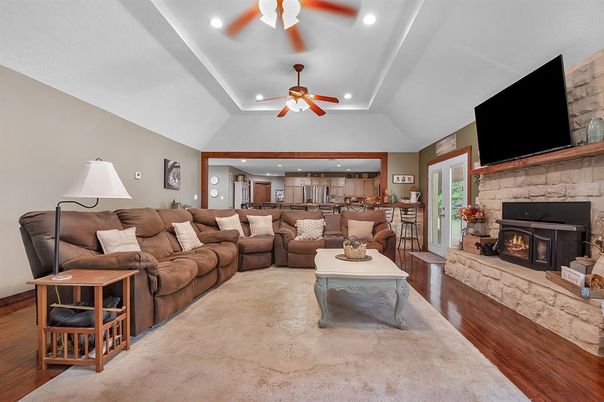 Fireplace, Interior, Kitchen, Living room, Recessed Lighting, Stone Walls, Wood Texture Flooring
