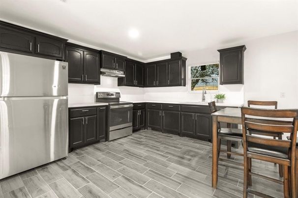 Dining room, Interior, Kitchen, Recessed Lighting, Stainless Steel Appliances, Wood Texture Flooring