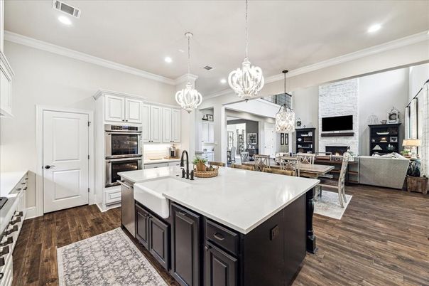 Dining room, Fireplace, Interior, Kitchen, Living room, Pendant Lights, Recessed Lighting, Stainless Steel Appliances, Wood Texture Flooring