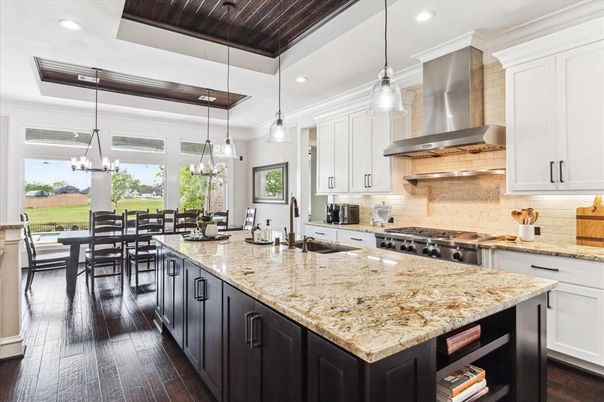 Chandelier, Dining room, Interior, Kitchen, Pendant Lights, Recessed Lighting, Stainless Steel Appliances, Wooden Ceilings, Wood Texture Flooring