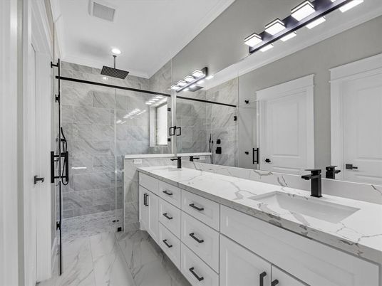Bathroom, Dual Sink Vanities, Glass Shower, Interior, Marble, Marble Walls, Recessed Lighting