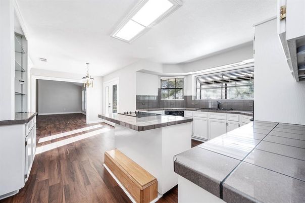 Interior, Kitchen, Pendant Lights, Tile Countertops, Wood Texture Flooring