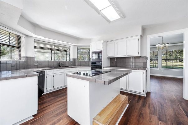 Chandelier, Interior, Kitchen, Tile Countertops, Wood Texture Flooring