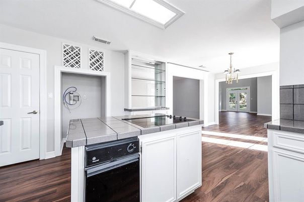 Interior, Kitchen, Pendant Lights, Tile Countertops, Wood Texture Flooring