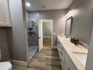 Bathroom, Dual Sink Vanities, Interior, Recessed Lighting, Wood Texture Flooring