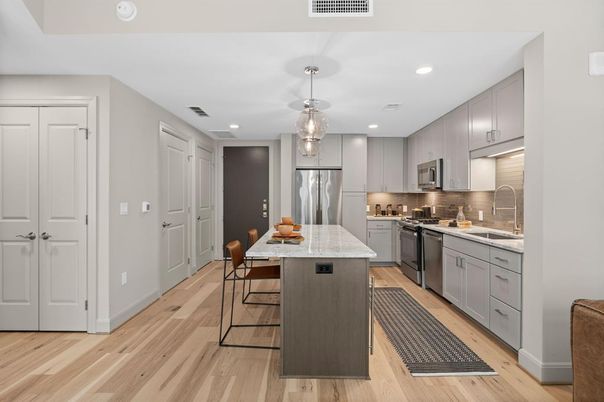 Dining room, Interior, Kitchen, Pendant Lights, Recessed Lighting, Stainless Steel Appliances, Wood Texture Flooring