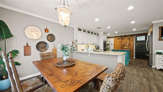 Dining room, Interior, Kitchen, Pendant Lights, Recessed Lighting, Stainless Steel Appliances, Wood Texture Flooring