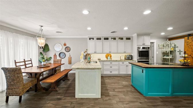 Dining room, Interior, Kitchen, Pendant Lights, Recessed Lighting, Stainless Steel Appliances, Wood Texture Flooring