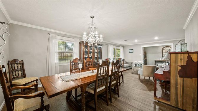 Chandelier, Dining room, Interior, Living room, Piano, Recessed Lighting, Wood Texture Flooring