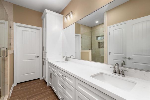 Bathroom, Dual Sink Vanities, Glass Shower, Interior, Recessed Lighting, Wood Texture Flooring