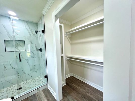 Bathroom, Glass Shower, Interior, Marble Walls, Recessed Lighting, Walk-in Closets, Wood Texture Flooring