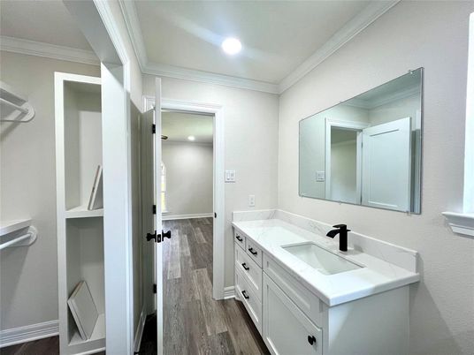 Bathroom, Dual Sink Vanities, Interior, Recessed Lighting, Walk-in Closets, Wood Texture Flooring