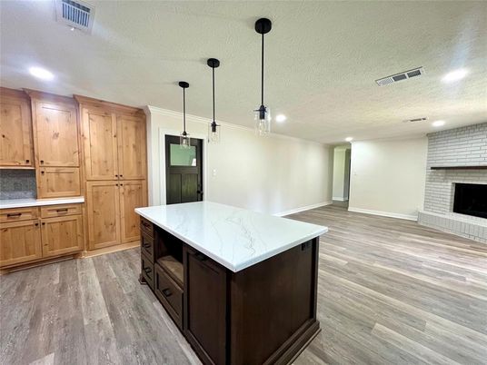 Fireplace, Interior, Kitchen, Pendant Lights, Recessed Lighting, Stone Walls, Wood Texture Flooring