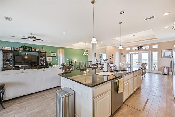 Chandelier, Dining room, Interior, Kitchen, Living room, Pendant Lights, Recessed Lighting, Wood Texture Flooring