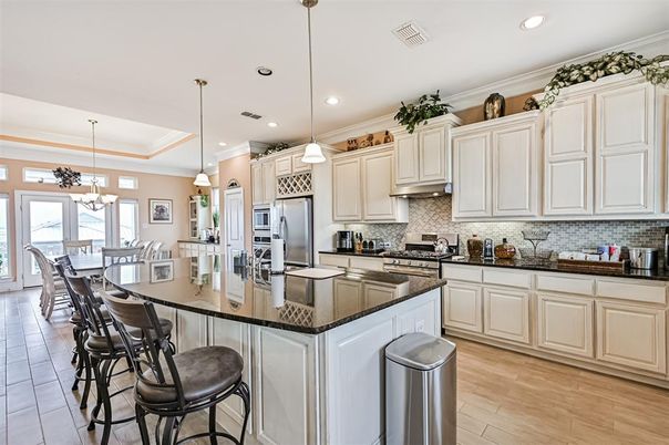 Chandelier, Dining room, Interior, Kitchen, Pendant Lights, Recessed Lighting, Stainless Steel Appliances, Wood Texture Flooring