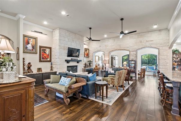 Fireplace, Interior, Living room, Recessed Lighting, Stone Walls, Wood Texture Flooring