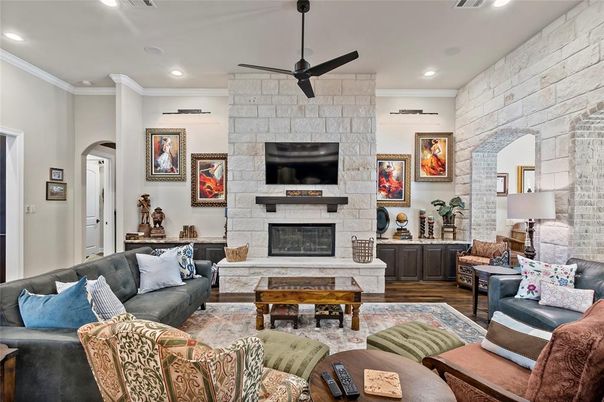 Fireplace, Interior, Living room, Recessed Lighting, Stone Walls, Wood Texture Flooring