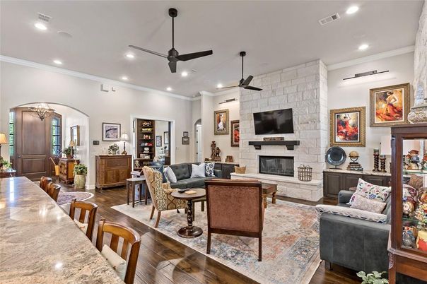 Fireplace, Interior, Living room, Recessed Lighting, Stone Walls, Wood Texture Flooring