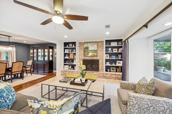 Dining room, Fireplace, Interior, Living room, Recessed Lighting, Stone Walls, Wood Texture Flooring