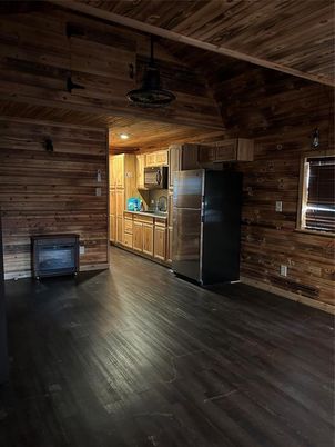 Empty room, Interior, Kitchen, Stainless Steel Appliances, Wooden Ceilings, Wood Texture Flooring, Wooden Walls
