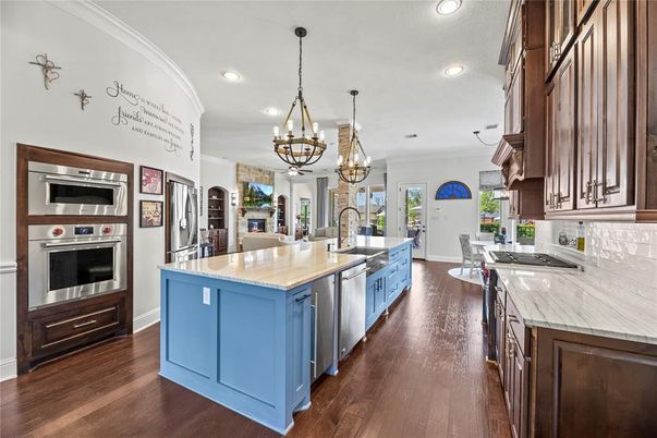 Chandelier, Interior, Kitchen, Pendant Lights, Recessed Lighting, Stainless Steel Appliances, Wood Texture Flooring