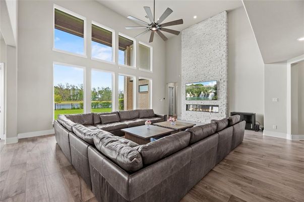 Fireplace, Interior, Living room, Recessed Lighting, Stone Walls, Wood Texture Flooring
