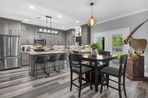 Dining room, Interior, Kitchen, Pendant Lights, Recessed Lighting, Stainless Steel Appliances, Wood Texture Flooring