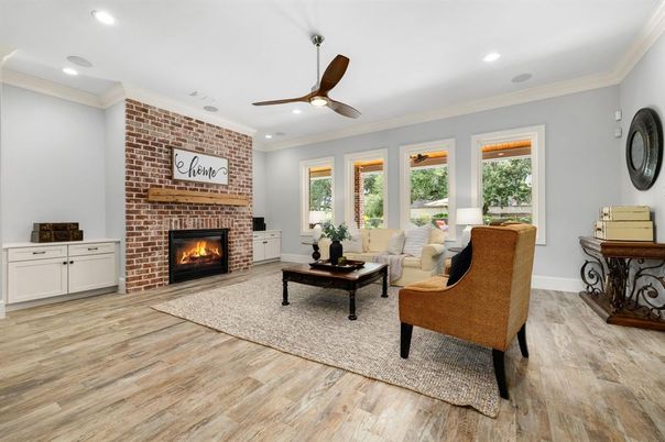 Fireplace, Interior, Living room, Recessed Lighting, Stone Walls, Wood Texture Flooring