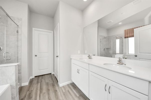 Bathroom, Dual Sink Vanities, Glass Shower, Interior, Recessed Lighting, Wood Texture Flooring