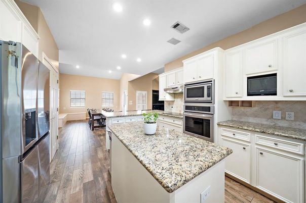 Dining room, Interior, Kitchen, Recessed Lighting, Stainless Steel Appliances, Wood Texture Flooring