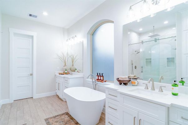 Bathroom, Dual Sink Vanities, Free Standing Baths, Glass Shower, Interior, Recessed Lighting, Wood Texture Flooring