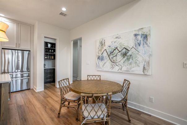 Dining room, Interior, Kitchen, Recessed Lighting, Stainless Steel Appliances, Wood Texture Flooring