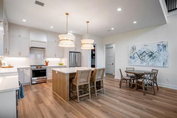 Dining room, Interior, Kitchen, Pendant Lights, Recessed Lighting, Stainless Steel Appliances, Wood Texture Flooring