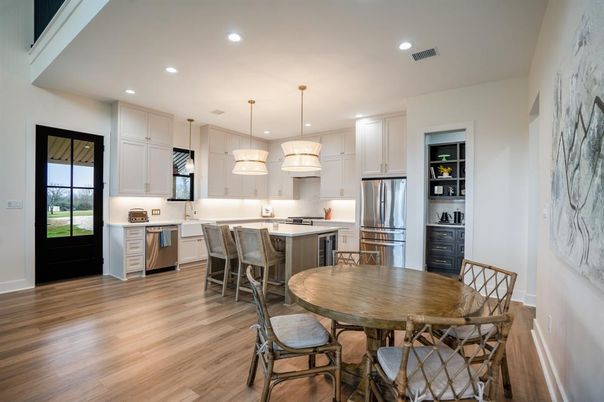 Dining room, Interior, Kitchen, Pendant Lights, Recessed Lighting, Stainless Steel Appliances, Wood Texture Flooring