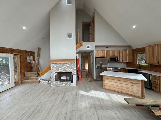Fireplace, Interior, Kitchen, Recessed Lighting, Stainless Steel Appliances, Wood Texture Flooring, Wooden Walls