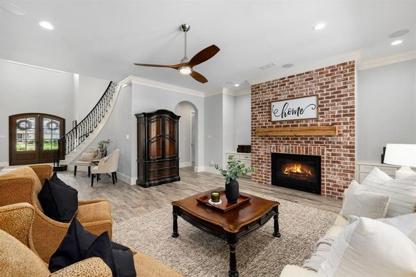 Fireplace, Interior, Living room, Recessed Lighting, Stone Walls, Wood Texture Flooring