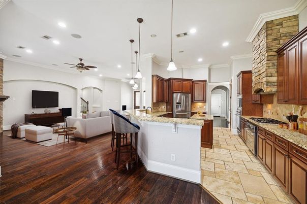 Interior, Kitchen, Living room, Pendant Lights, Recessed Lighting, Stainless Steel Appliances, Stone Walls, Wood Texture Flooring