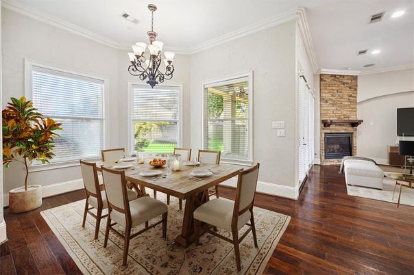 Chandelier, Dining room, Fireplace, Interior, Recessed Lighting, Stone Walls, Wood Texture Flooring