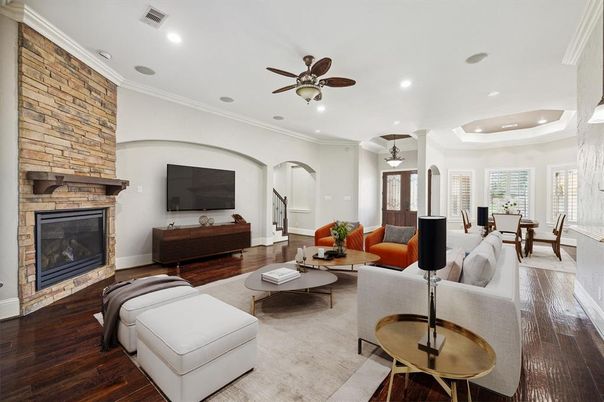 Dining room, Fireplace, Interior, Living room, Recessed Lighting, Stone Walls, Wood Texture Flooring