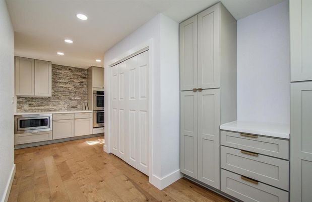 Interior, Kitchen, Recessed Lighting, Stainless Steel Appliances, Stone Walls, Wood Texture Flooring