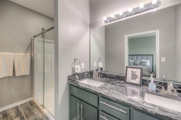 Bathroom, Bedroom, Dual Sink Vanities, Glass Shower, Interior, Wood Texture Flooring