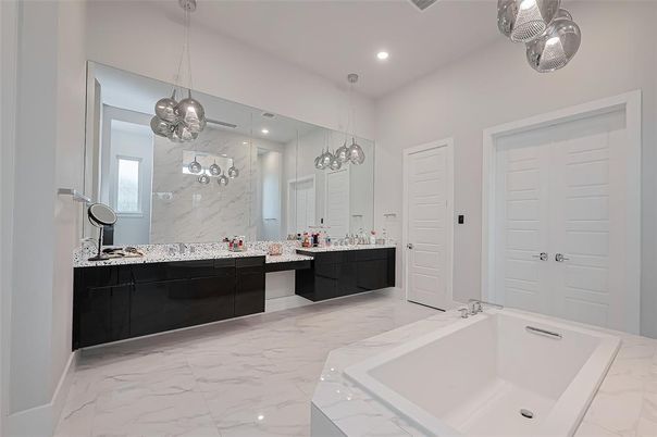 Bathroom, Dual Sink Vanities, Interior, Marble, Marble Walls, Pendant Lights, Recessed Lighting