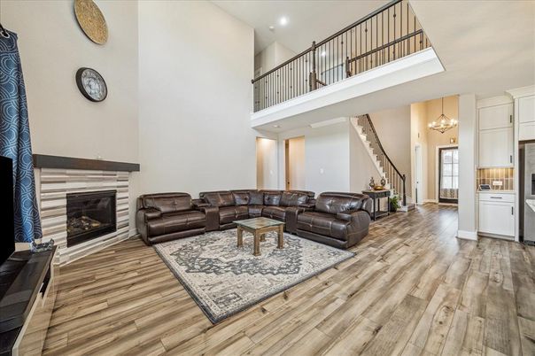 Chandelier, Fireplace, Interior, Living room, Pendant Lights, Recessed Lighting, Wood Texture Flooring